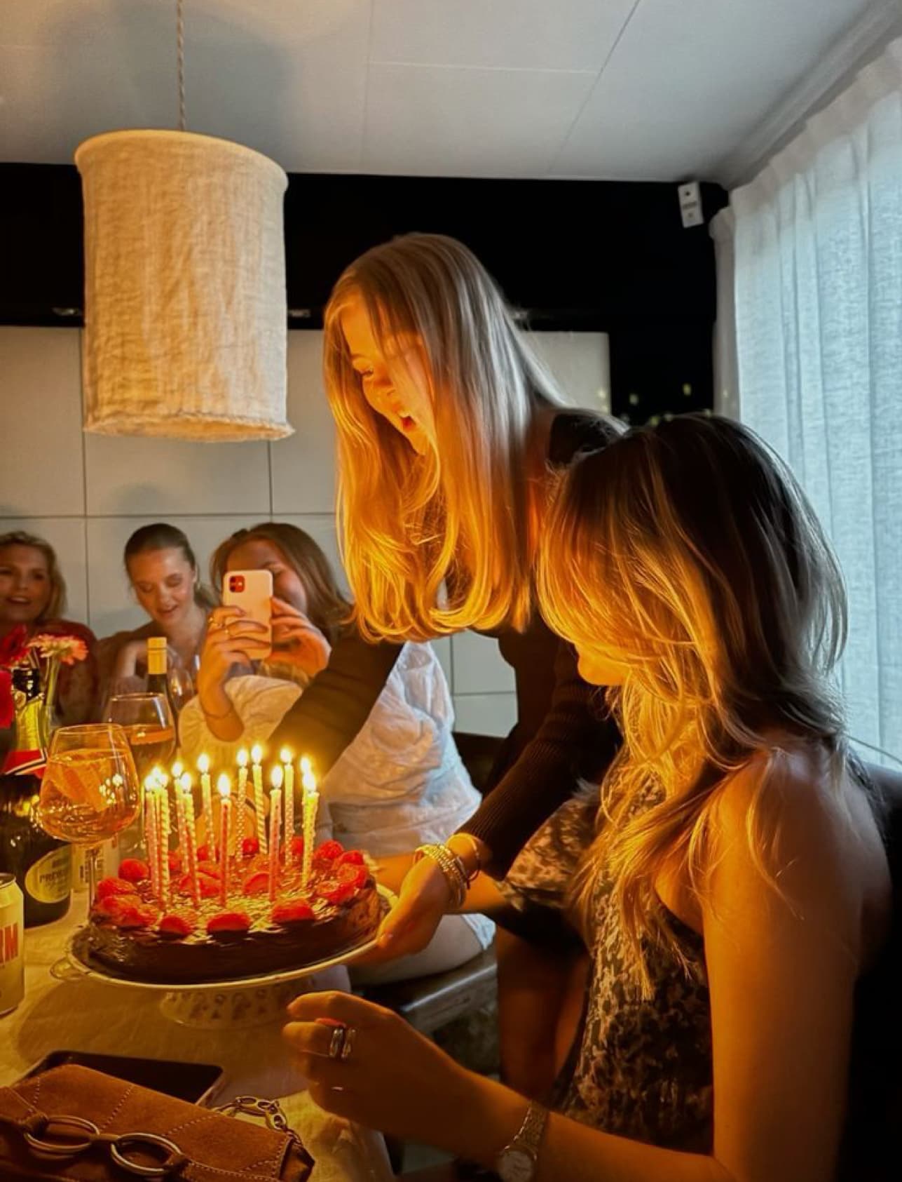 Birthday celebration with candles and joyful atmosphere